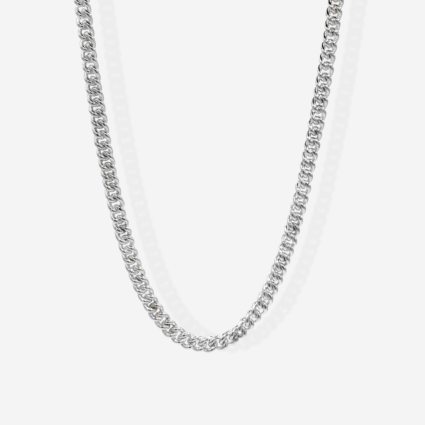 Each link of the Curb chain is carefully shaped to form a tight sequence of gently curved links that lay flat on the wearer.